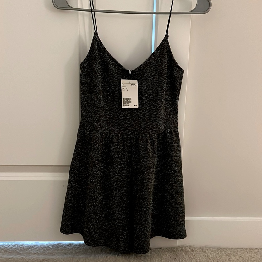 Beautiful sparkly romper. NEVER WORN.